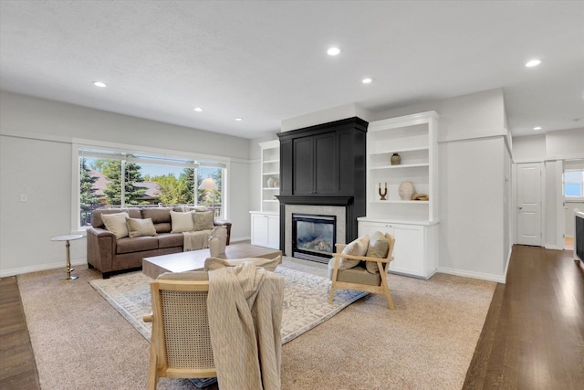 2306 W Rainier Ct, Spokane, WA 99208 - living area featuring a large fireplace, wood finished floors, recessed lighting, and baseboards