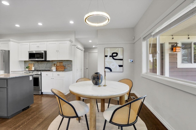 2306 W Rainier Ct, Spokane, WA 99208 - dining space featuring dark wood-style floors, baseboards, recessed lighting, and a chandelier