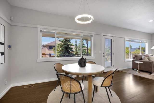 2306 W Rainier Ct, Spokane, WA 99208 - dining room featuring baseboards and wood finished floors