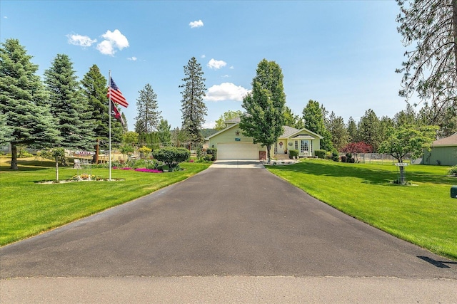 16324 N Cimmeron Ct, Nine Mile Falls, WA 99026 - view of front facade featuring an attached garage, a front lawn, and driveway