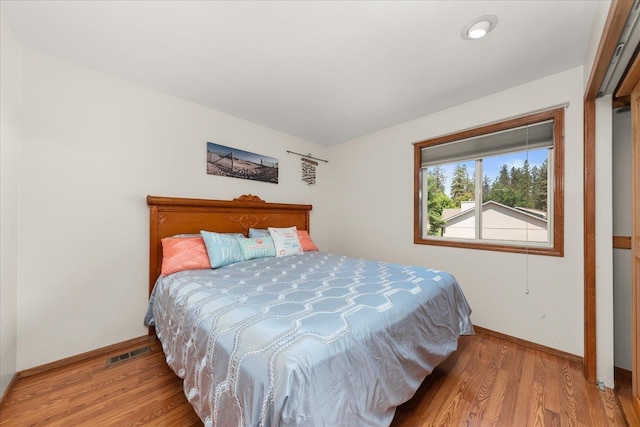 16324 N Cimmeron Ct, Nine Mile Falls, WA 99026 - bedroom with baseboards and light wood-type flooring