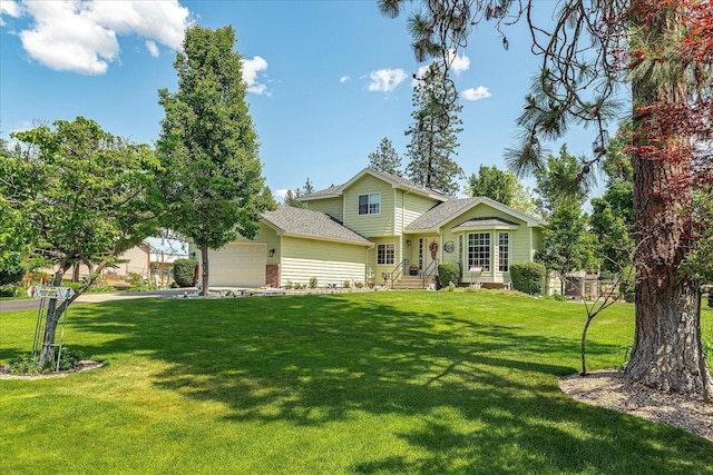 16324 N Cimmeron Ct, Nine Mile Falls, WA 99026 - view of front of home with an attached garage, a front lawn, and a shingled roof