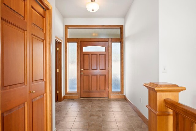 8518 E Black Oak Ln, Spokane, WA 99217 - entryway with plenty of natural light, baseboards, and light tile patterned floors