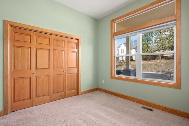 8518 E Black Oak Ln, Spokane, WA 99217 - unfurnished bedroom with carpet flooring, baseboards, and a closet