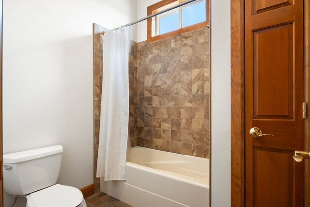 8518 E Black Oak Ln, Spokane, WA 99217 - bathroom with toilet, shower / tub combo with curtain, baseboards, and tile patterned flooring