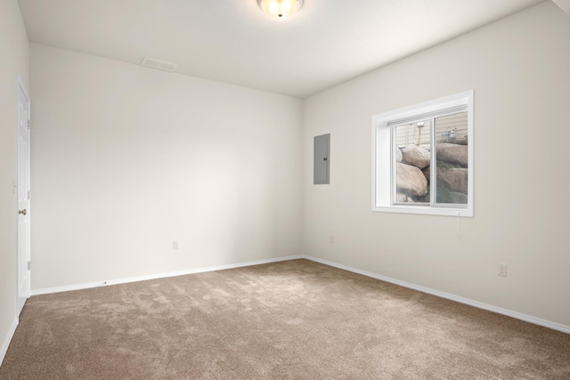 8518 E Black Oak Ln, Spokane, WA 99217 - spare room featuring carpet, electric panel, and baseboards