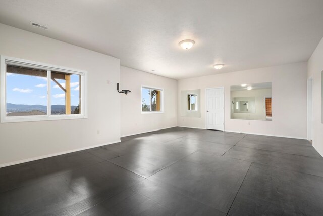 8518 E Black Oak Ln, Spokane, WA 99217 - unfurnished living room featuring baseboards and electric panel