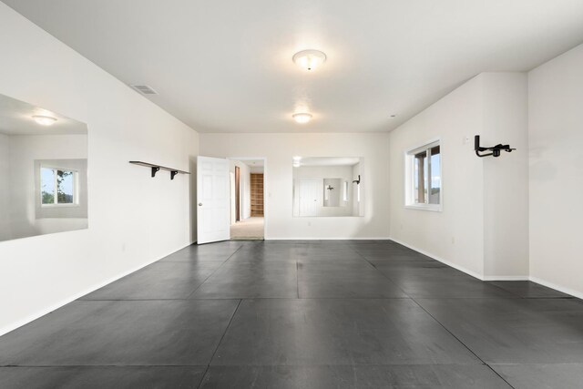 8518 E Black Oak Ln, Spokane, WA 99217 - empty room with baseboards, concrete flooring, and electric panel