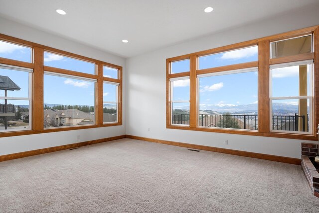 8518 E Black Oak Ln, Spokane, WA 99217 - spare room featuring baseboards, carpet, healthy amount of natural light, and recessed lighting