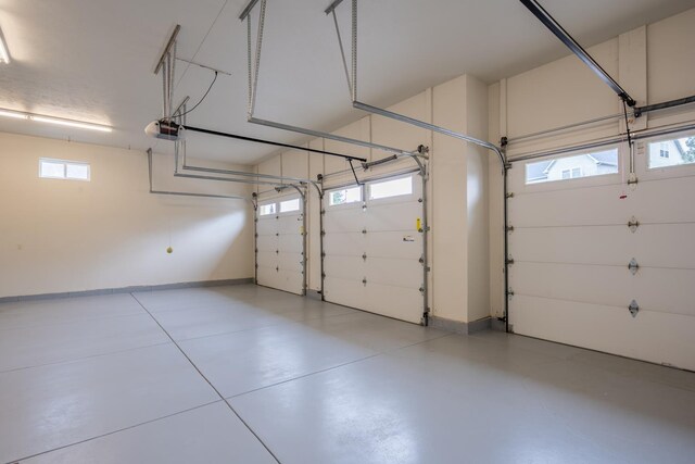 8518 E Black Oak Ln, Spokane, WA 99217 - garage featuring a garage door opener and baseboards