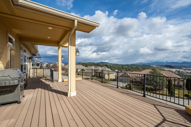 8518 E Black Oak Ln, Spokane, WA 99217 - wooden deck featuring a residential view, grilling area, and a mountain view
