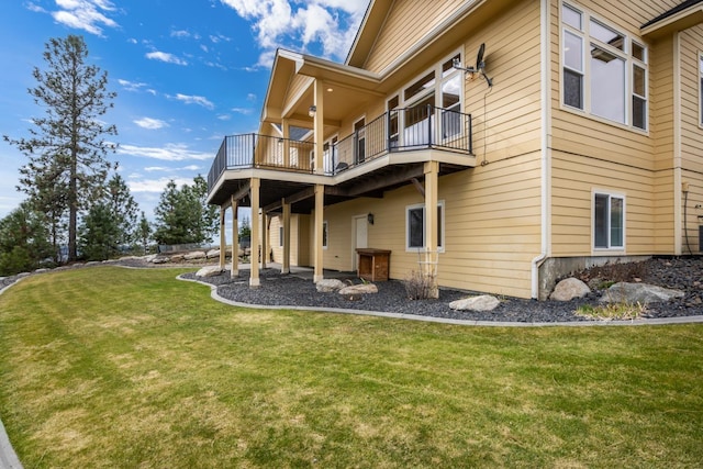 8518 E Black Oak Ln, Spokane, WA 99217 - back of property featuring a balcony and a lawn