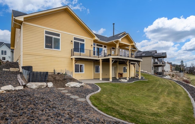 8518 E Black Oak Ln, Spokane, WA 99217 - rear view of house with a lawn and a balcony