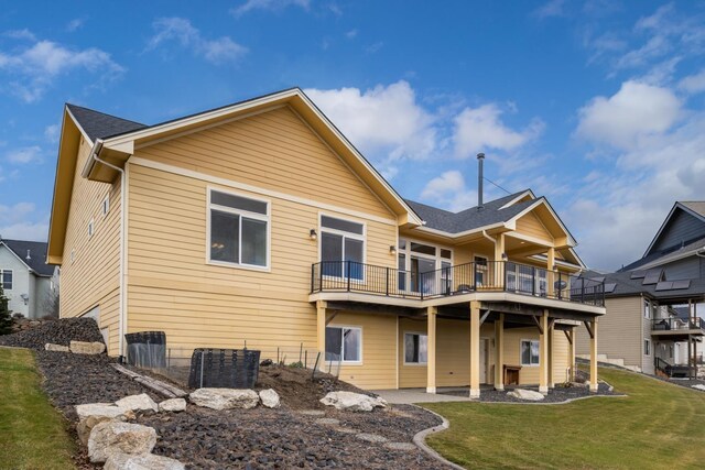 8518 E Black Oak Ln, Spokane, WA 99217 - rear view of house featuring a lawn and a balcony