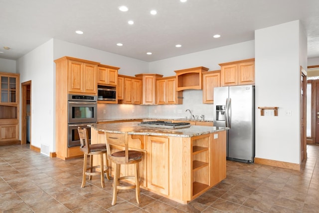 8518 E Black Oak Ln, Spokane, WA 99217 - kitchen featuring appliances with stainless steel finishes, open shelves, a sink, a kitchen island, and light stone countertops
