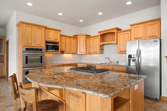 8518 E Black Oak Ln, Spokane, WA 99217 - kitchen with appliances with stainless steel finishes, open shelves, a sink, a center island, and recessed lighting