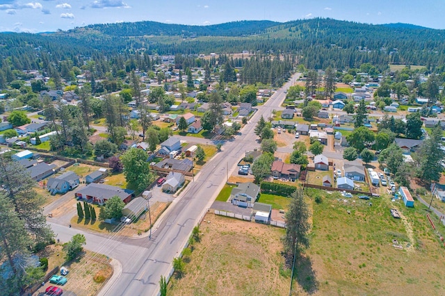 512 S Thierman Rd, Spokane Valley, WA 99212 - aerial overview of property's location featuring a forest, nearby suburban area, and mountains