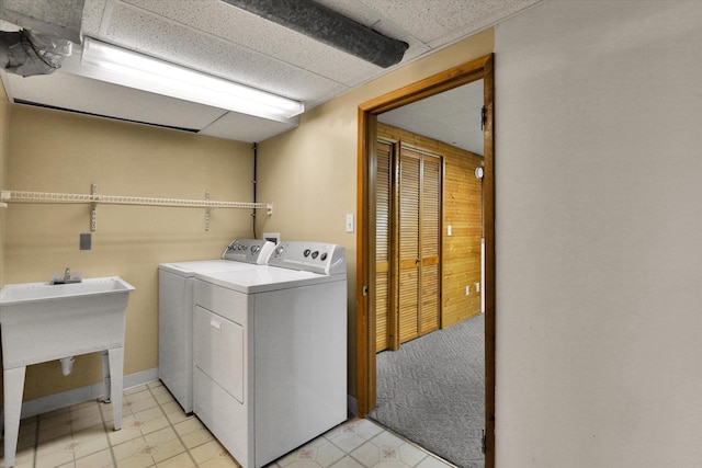 1010 W Westmont Way, Spokane, WA 99208 - washroom featuring washing machine and dryer and light tile patterned floors