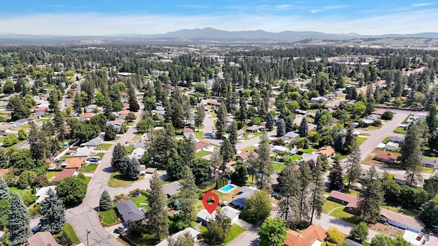 1010 W Westmont Way, Spokane, WA 99208 - aerial overview of property's location featuring a mountain backdrop