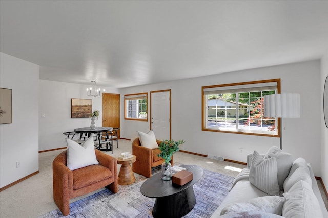 1010 W Westmont Way, Spokane, WA 99208 - living area with a chandelier, baseboards, and light carpet