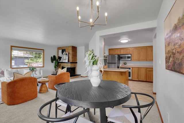 1010 W Westmont Way, Spokane, WA 99208 - dining area with a chandelier and a brick fireplace