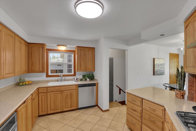 1010 W Westmont Way, Spokane, WA 99208 - kitchen featuring appliances with stainless steel finishes, a sink, light tile patterned floors, and light countertops