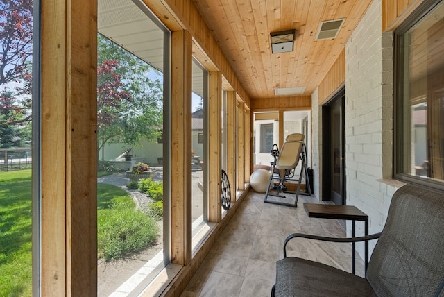 2203 W Strong Rd, Spokane, WA 99208 - sunroom / solarium with healthy amount of natural light, wood ceiling, and brick wall
