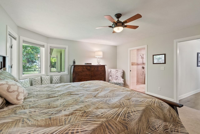 2203 W Strong Rd, Spokane, WA 99208 - bedroom featuring connected bathroom, baseboards, and a ceiling fan