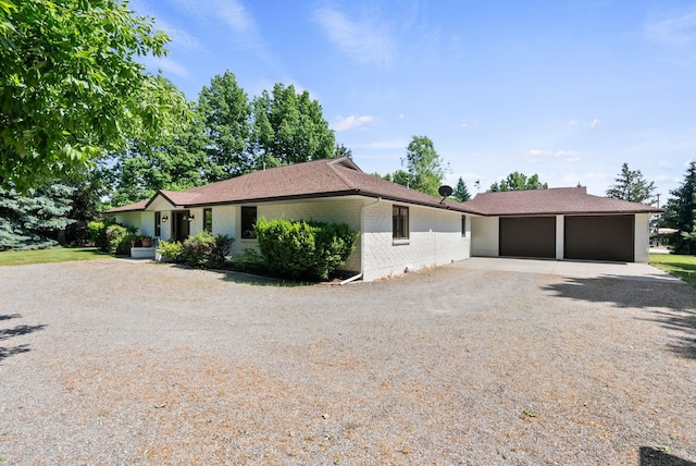 2203 W Strong Rd, Spokane, WA 99208 - ranch-style home featuring driveway, brick siding, and a garage