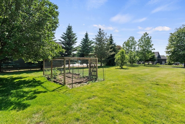2203 W Strong Rd, Spokane, WA 99208 - view of green lawn featuring a vegetable garden