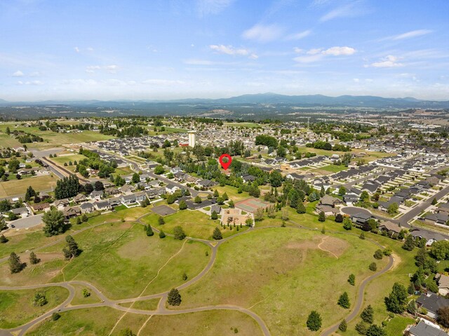 2203 W Strong Rd, Spokane, WA 99208 - aerial view of property and surrounding area featuring mountains and nearby suburban area