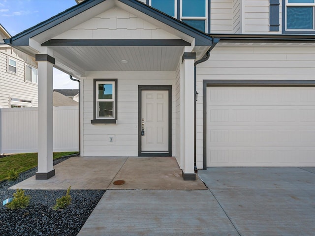 5112 N Silas Ln Unit 9/1Talent, Spokane Valley, WA 99216 - doorway to property featuring a garage and concrete driveway