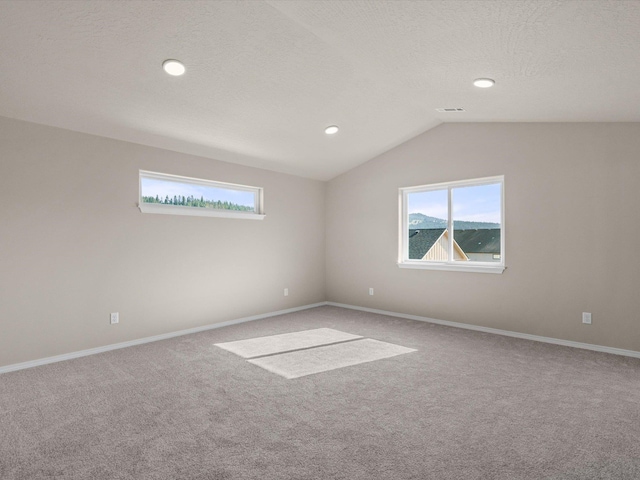5112 N Silas Ln Unit 9/1Talent, Spokane Valley, WA 99216 - empty room with carpet flooring, healthy amount of natural light, vaulted ceiling, baseboards, and recessed lighting