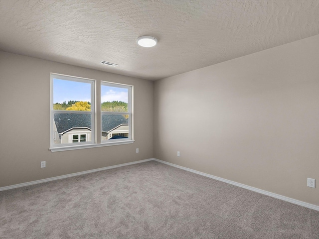 5112 N Silas Ln Unit 9/1Talent, Spokane Valley, WA 99216 - carpeted empty room with baseboards and a textured ceiling