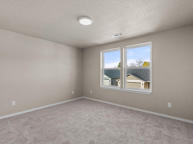 5112 N Silas Ln Unit 9/1Talent, Spokane Valley, WA 99216 - carpeted spare room with a textured ceiling and baseboards