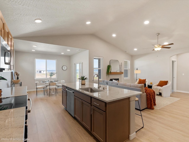 1583 W 68th Ave Lot 11Block 1, Orchard, Spokane, WA 99224 - kitchen with a sink, stainless steel appliances, light wood-style flooring, a fireplace, and vaulted ceiling