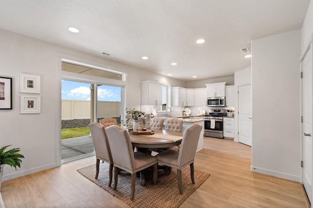 1624 W 68th Ave Unit 2/2Timberline, Spokane, WA 99224 - dining space with light wood finished floors, baseboards, and recessed lighting