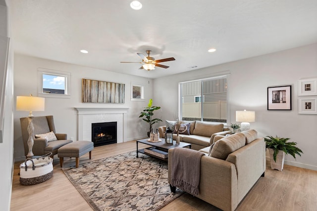 1624 W 68th Ave Unit 2/2Timberline, Spokane, WA 99224 - living room with a ceiling fan, baseboards, light wood-type flooring, a warm lit fireplace, and recessed lighting