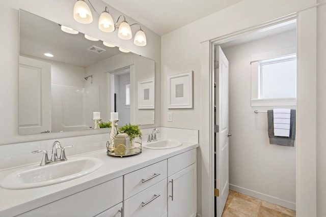 1624 W 68th Ave Unit 2/2Timberline, Spokane, WA 99224 - bathroom with double vanity, baseboards, and a shower
