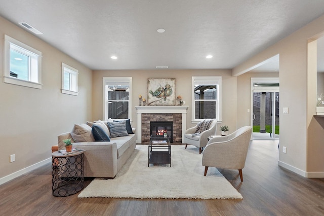 1638 W 68th Ave Unit 1/2Talent, Spokane, WA 99224 - living room with baseboards, wood finished floors, recessed lighting, and a stone fireplace