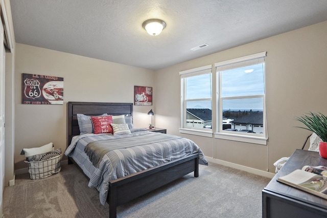 1638 W 68th Ave Unit 1/2Talent, Spokane, WA 99224 - carpeted bedroom with baseboards and a textured ceiling