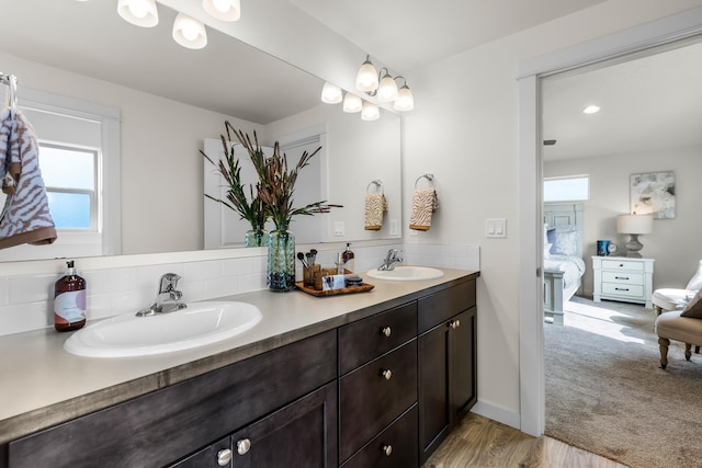 1638 W 68th Ave Unit 1/2Talent, Spokane, WA 99224 - ensuite bathroom featuring double vanity, plenty of natural light, and wood finished floors