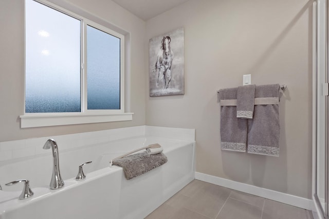 1638 W 68th Ave Unit 1/2Talent, Spokane, WA 99224 - full bathroom featuring plenty of natural light, a bath, baseboards, and tile patterned floors