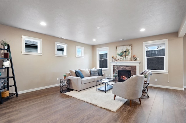 1638 W 68th Ave Unit 1/2Talent, Spokane, WA 99224 - living area featuring wood finished floors, a fireplace, baseboards, and recessed lighting