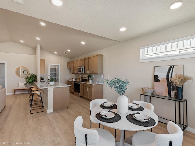 1438 W 67th Ave Lot 5Block 3, Orchard, Spokane, WA 99224 - dining space with light wood finished floors, lofted ceiling, recessed lighting, and baseboards