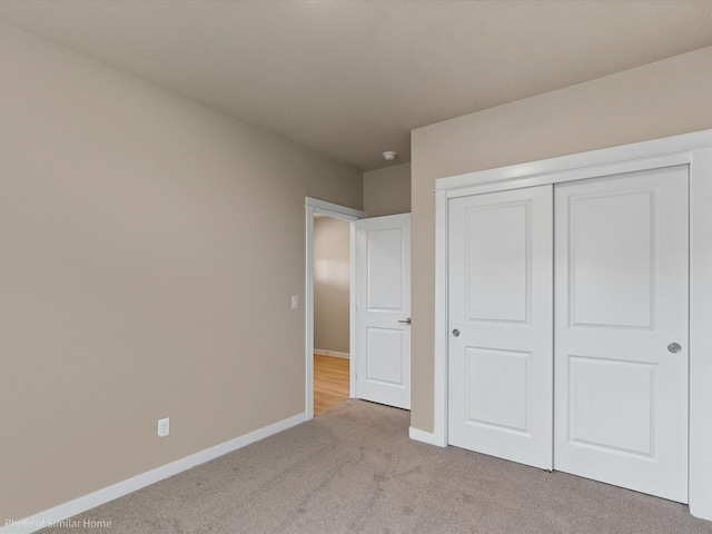 1438 W 67th Ave Lot 5Block 3, Orchard, Spokane, WA 99224 - unfurnished bedroom featuring light colored carpet, baseboards, and a closet