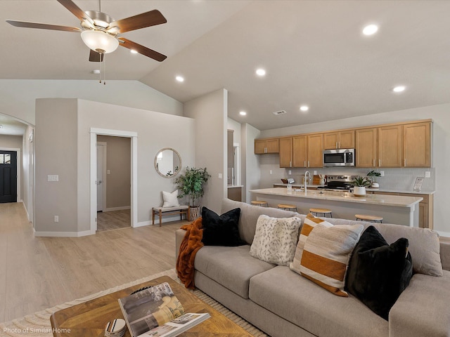 1438 W 67th Ave Lot 5Block 3, Orchard, Spokane, WA 99224 - living area with arched walkways, a ceiling fan, light wood-style flooring, vaulted ceiling, and recessed lighting