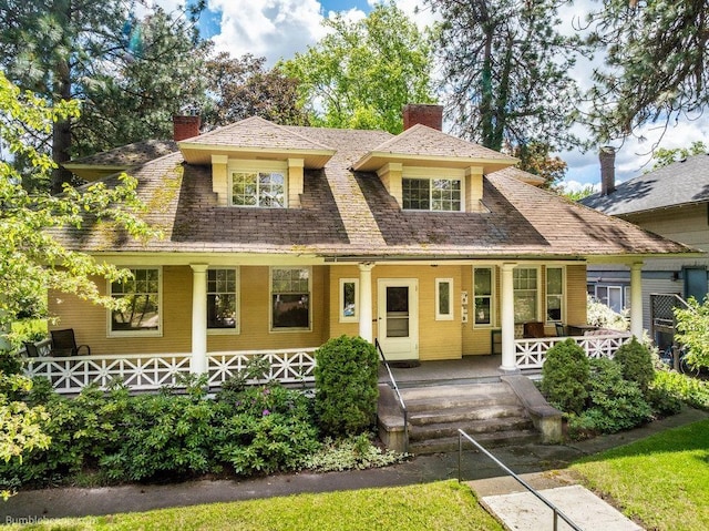 1611 W 9th Ave, Spokane, WA 99223 - view of front of house featuring a chimney and covered porch