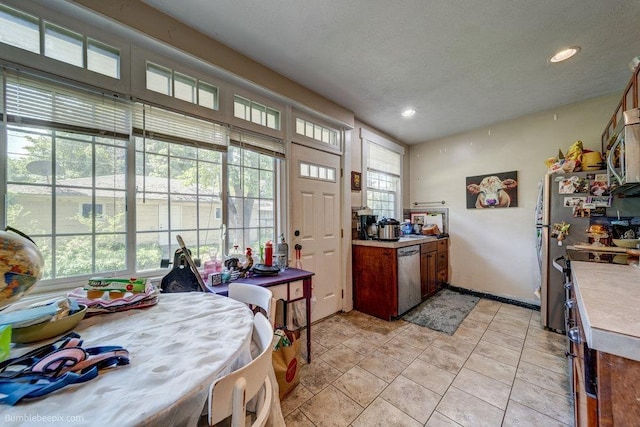 1611 W 9th Ave, Spokane, WA 99223 - kitchen featuring stainless steel appliances, recessed lighting, light countertops, and brown cabinetry