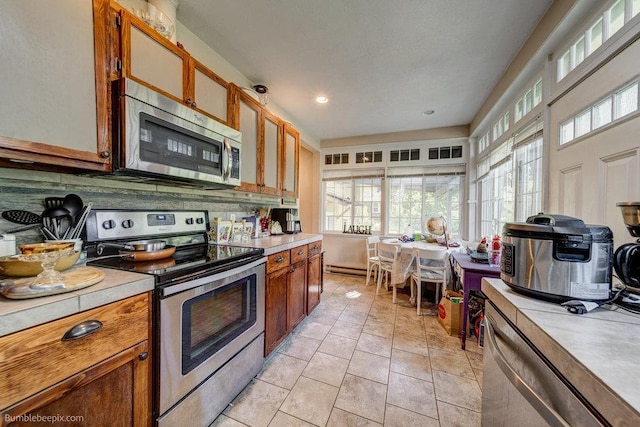 1611 W 9th Ave, Spokane, WA 99223 - kitchen with stainless steel appliances, light countertops, and plenty of natural light